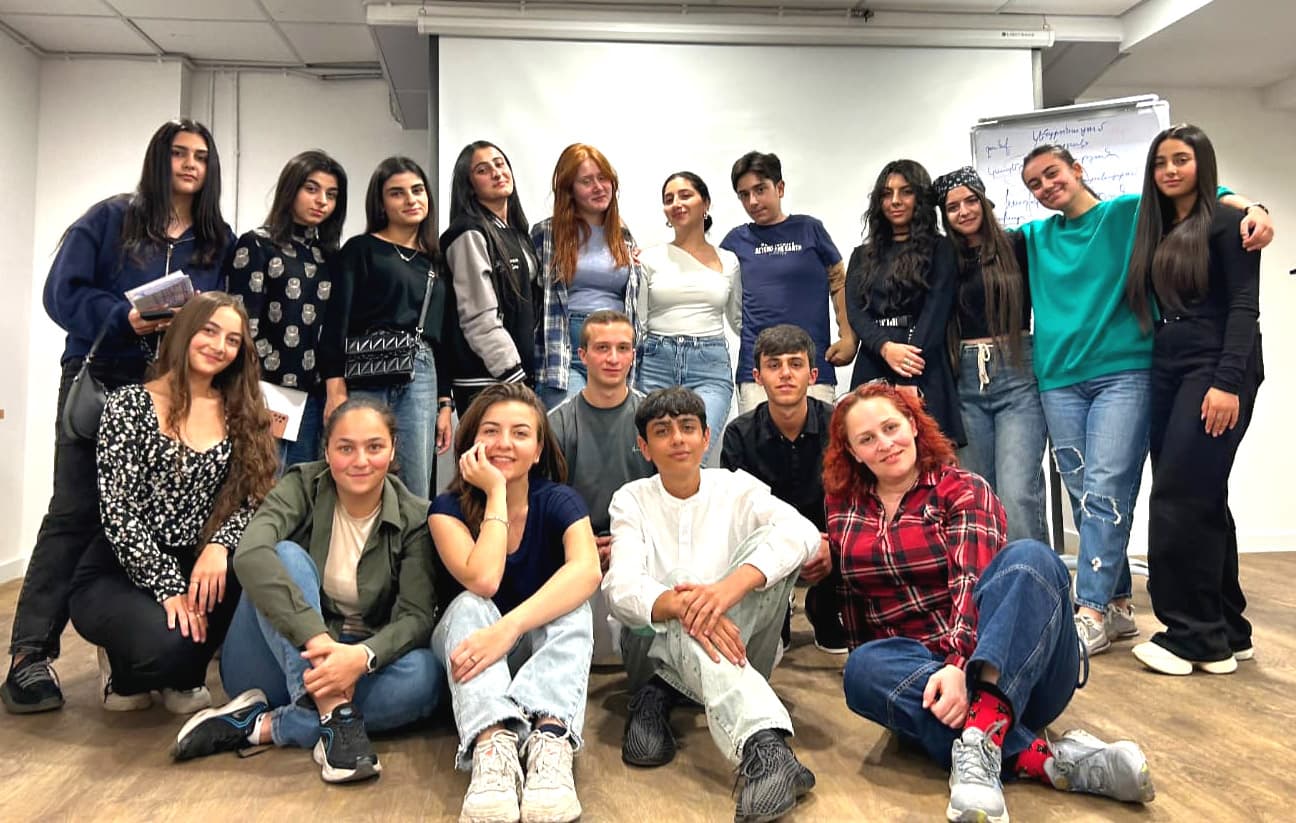 A group of DU EL participants at a program meeting